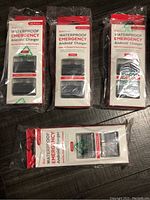Four waterproof emergency Android chargers in original sealed packaging, showing front packaging details and quantity.