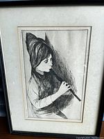 Full framed etching showing a girl playing a flute or recorder, rendered in black and white lines.