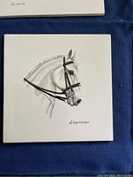 Hand-painted tile depicting a close-up of Lipizzaner horse head with bridle and the word Lipizzaner beneath it.