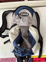 North 49 branded small backpack with padded straps and mesh sections for ventilation.