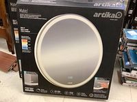 Front of box showing Artika branded Mateo LED wall mirror with integrated defogger and edge-lit frame