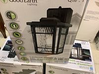 Stack of Good Earth Lighting Outdoor LED Wall Lantern boxes, front view