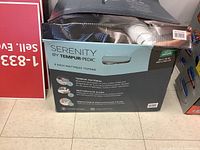 Front of box showing Serenity by Tempur-Pedic branding, 3 inch mattress topper, King size 78 x 80 in