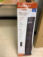 Full front view of the Lasko tower heater box showing product and brand name, and partial image of product.