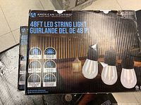 Shows the packaging of the American Lighting 48ft LED string lights with image of bulbs and technical specifications.