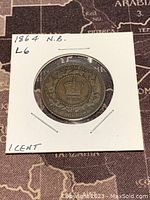 Reverse of 1864 New Brunswick Large 1 Cent coin showing crown design and inscriptions.