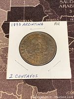 Front side of 1893 Argentina 2 centavos coin showing Argentine coat of arms and date.