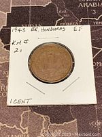 Reverse side of 1943 British Honduras one cent coin showing denomination and laurel decoration.