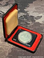 1972 Canadian silver dollar coin in its display case showing the coin and the 1972 SILVER label.
