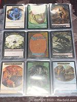 Front view of nine assorted Magic: The Gathering cards showing various creature and spell cards in plastic sleeves.