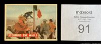 Front of card titled 'Storming the Walls' showing scene with men climbing ladder with flag.