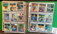 Binder pages holding multiple 1984 Fleer baseball cards with images of players from the New York Mets and other teams.