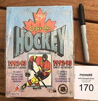 Front view of sealed 1992-93 O-Pee-Chee hockey card wax box showing hockey player artwork and branding.