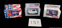 Front view of three unopened Montreal Expos diecast Matchbox cars from 1996, 1997, and 1998. Each box displays the respective year and Expos colors and logos.