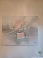 Front view of the abstract canvas painting with pink, blue, and gray colors and visible artist signature.