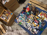 Overhead view of all acrylic paints, brushes and organizer on moving blanket