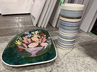 Full view of floral tray and striped vase showing overall condition and design