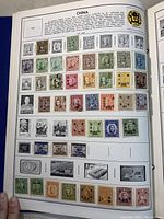 Photo of a full page of Chinese stamps with description text, featuring multiple rows of various stamps including portraits and commemorative designs