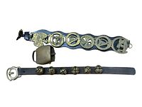 Top-down photo of all items showing the bridle strap with medallions, cowbell, and sleigh bell strap on a wooden surface.