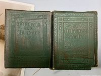 Two antique Little Library books: Dr. Jekyll and Mr. Hyde and A Tillyloss Scandal with green embossed covers and gold lettering.