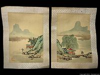 Pair of signed Japanese watercolor paintings on cloth with landscape scenes, photographed in low light