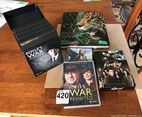 Top view showing all items including the Rainforest Safari coffee table book, Foyle's War DVD sets and Firefly DVD set.
