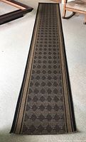 Full view of the runner rug laid out flat showing pattern and dimensions.