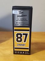 Box showing branding and collectible information for Sidney Crosby NHL hockey stick.