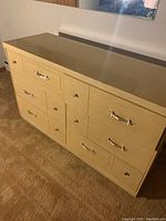 Side and front angle of the vintage wooden dresser showing drawer arrangement and condition.