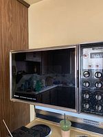 Frigidaire oven door and control panel visible with kitchen background.