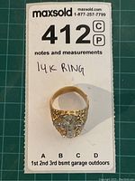 Ring laid flat showing full front profile against measurement grid