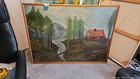 Full view of the oil painting showing the cabin with smoke from the chimney beside trees and a stream with mountains in the background.