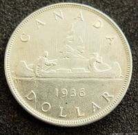 Reverse side showing canoe with two men and inscriptions 'CANADA', 'DOLLAR', and year '1936'.