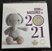 Front cover of the Canadian Mint 2021 Born set featuring a crocheted elephant and a coin displayed in the cover.