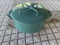 Front angle of blue-green Dansk pot showing shape and handles