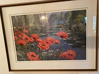 Front view of framed print showing red poppies, water pond, reflected trees, signed and numbered.