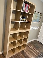 Full view of two stacking cube bookshelves units arranged vertically against wall, with multiple square compartments visible.
