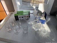 Full view of all glassware including decanter, various tumblers, brandy snifters, cocktail glasses, and whiskey tumbler.