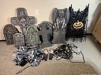 Overview of all tombstone shapes, fence panels, yard stakes, zombie hands and lights