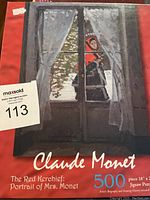Claude Monet 500-piece jigsaw puzzle box featuring The Red Kerchief Portrait of Mrs. Monet artwork.