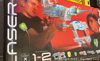 Box front showing two male users wearing sensor vests and holding Laser X Fusion laser tag guns. Clear branding visible with the text 'Laser X Fusion' and '1 or 2 Players'.