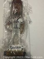 Front view of the Ron Gant bobblehead sealed in plastic, showing full figure and base