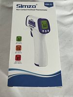 Front view of the Simzo HW-F7 non-contact forehead thermometer retail box, showing the product image and basic features.