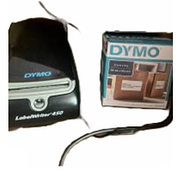 DYMO LabelWriter 450 label printer and box of label refills side by side showing brand and product details.