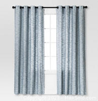 Curtains hung on rod showing full panel length and texture.