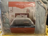 Packaged Opalhouse duvet cover set with image of styled bed featuring the duvet and pillows.