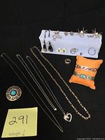 Overview of sterling silver jewelry lot including necklaces, bracelets, earrings, ring and brooch