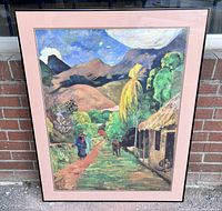 Framed print of "A Street in Tahiti" by Paul Gauguin shown outside against brick wall, visible colors and overall condition.