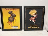 Front view of the pair of framed Deco style French advertising posters: Parapluie-Revel and Cognac Monnet.