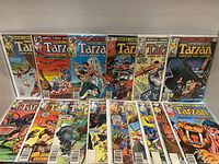 Front view of 16 Tarzan comic books from Marvel Comics Vol. 2 showing bright colorful covers with characters in jungle and action scenes.